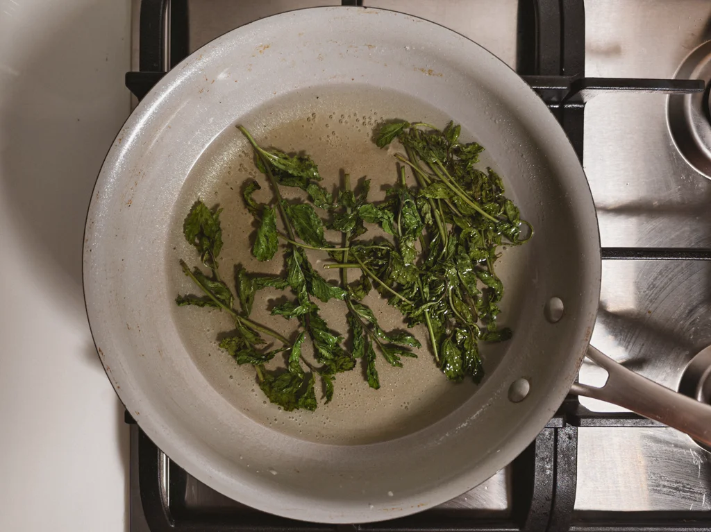 Sugar water and mint sprigs in a medium saucepan.