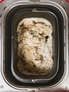 Mixing easy bread maker bread loaf ingredients.